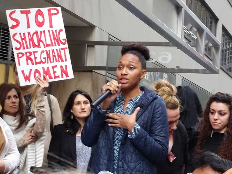 Myoshi Benton speaks out on Shackling pregnant women at a rally in New York.