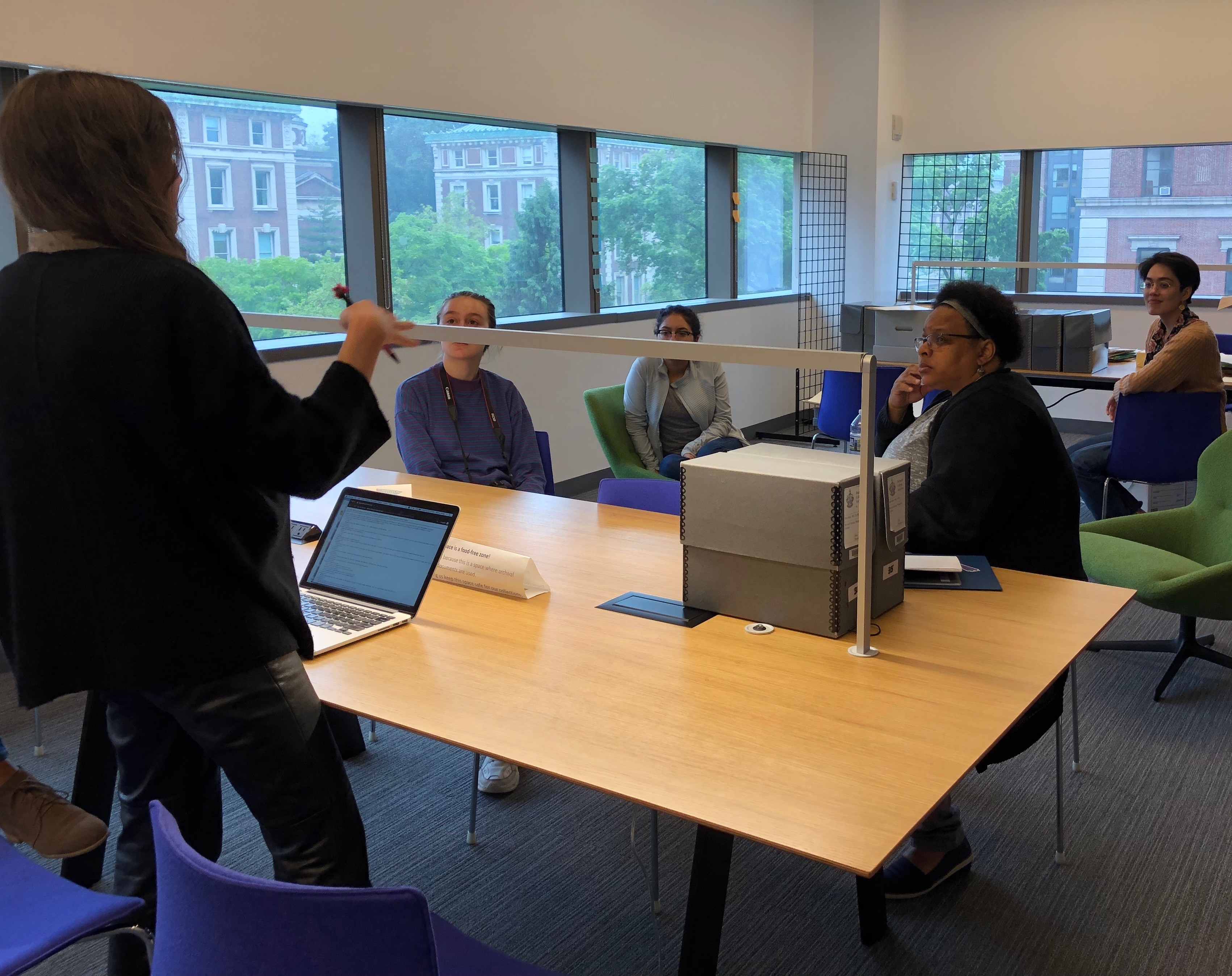 Archivist and researchers in the archives reading room